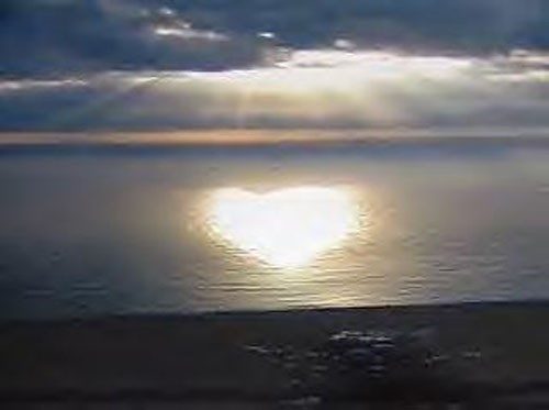 image of white heart on surface of ocean